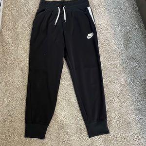 Black Nike joggers, size large